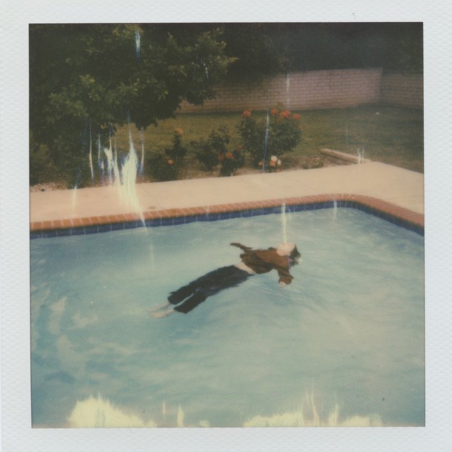 Cover of dead girl in the pool.